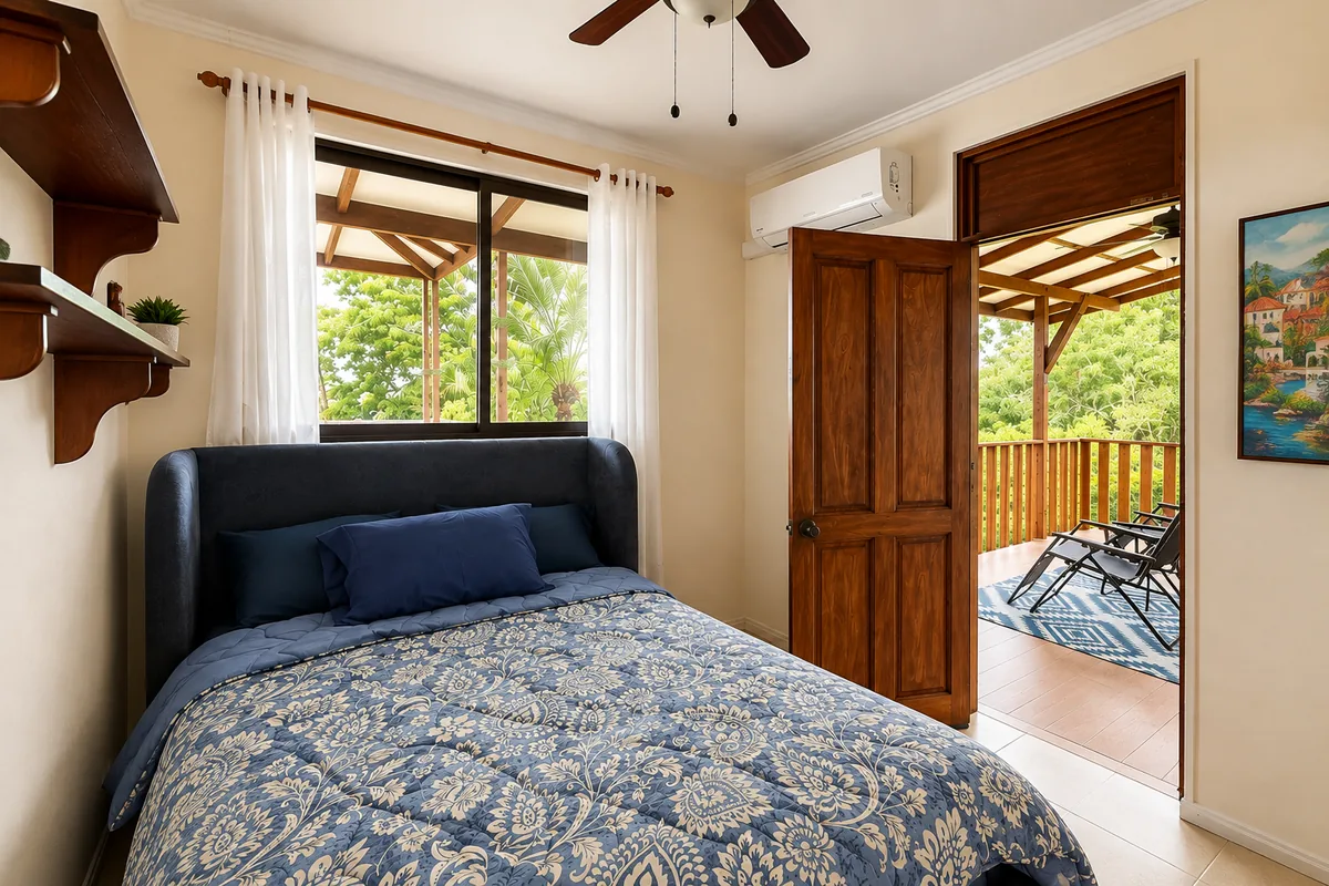 Bedroom 4 with a full-size bed and balcony access