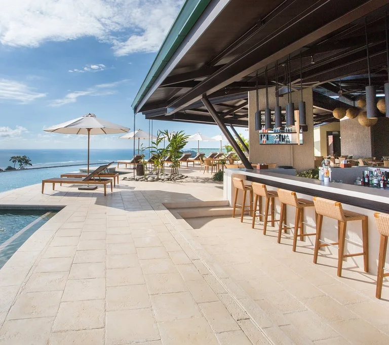 Bar 360 at Hotel Three Sixty, an infinity pool and open-air bar overlooking the Pacific