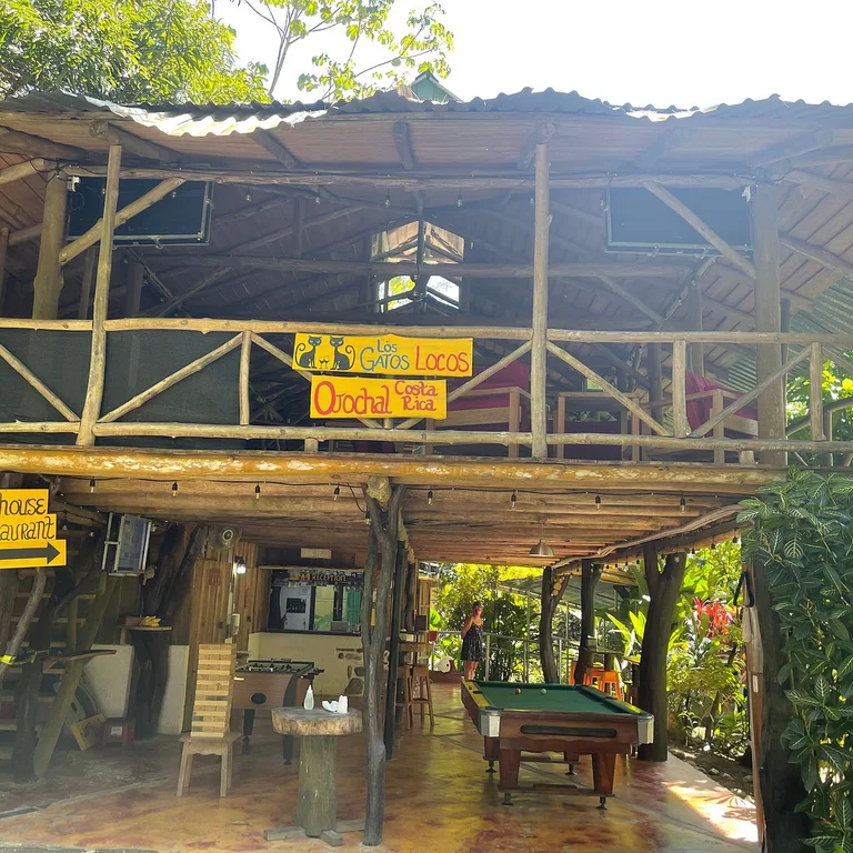 Los Gatos Locos’ two-level open-air treehouse restaurant with pool table and foosball
