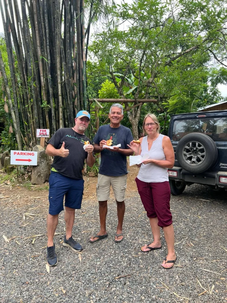 Guests holding fresh pastries from Pan y Amor bakery outside in Ojochal